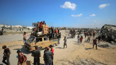 Palestinians seek aid supplies from the U.S.-backed Gaza Humanitarian Foundation (GHF), in the central Gaza Strip, August 4, 2025. REUTERS/Stringer