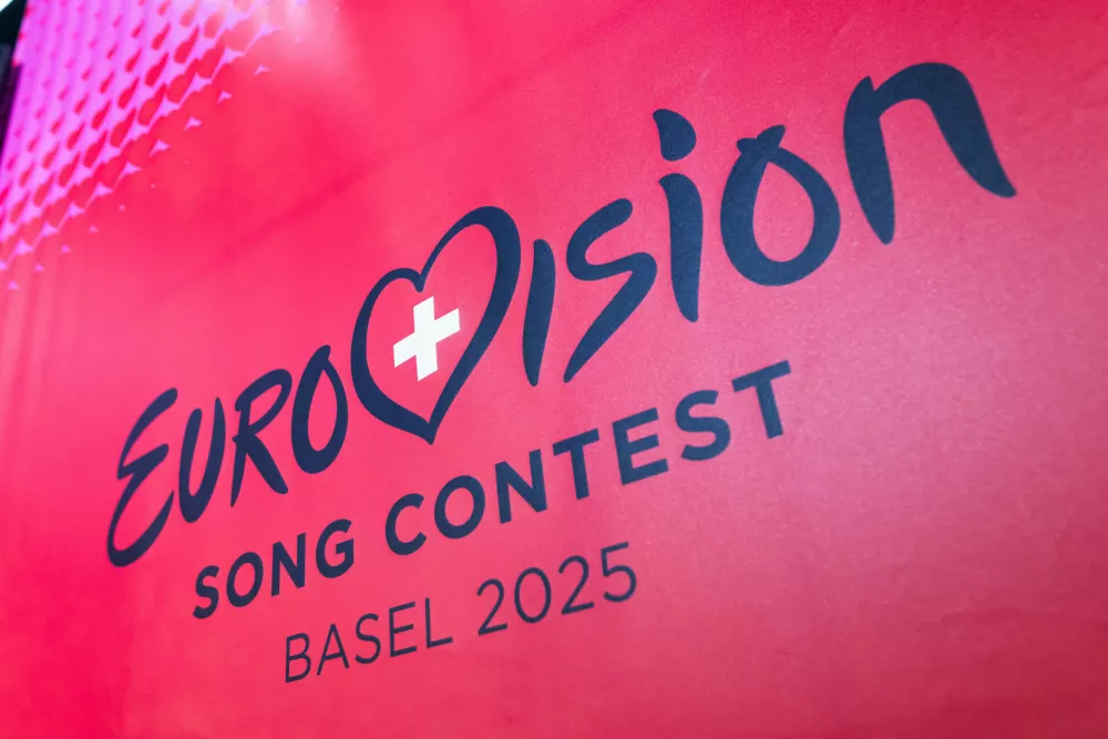 FILED - 16 December 2024, Switzerland, Basel: The logo of the Eurovision Song Contest (ESC) 2025 can be seen on a banner. Photo: Philipp von Ditfurth/dpa / Foto: Philipp Von Ditfurth