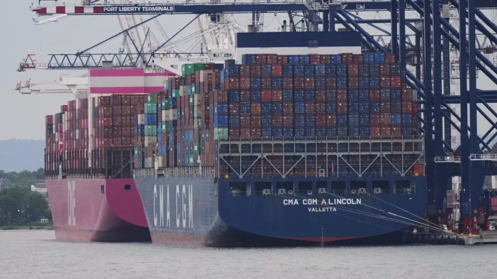 Cargo ships are docked at Port Liberty Terminals, Wednesday, Aug. 6, 2025, in New York. (AP Photo/Frank Franklin II)