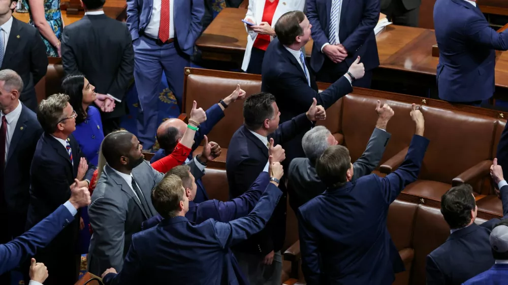 Members of the U.S. House of Representatives react after the U.S. President Donald Trump's sweeping spending and tax bill passes, on Capitol Hill in Washington, D.C., U.S., July 3, 2025. REUTERS/Umit Bektas