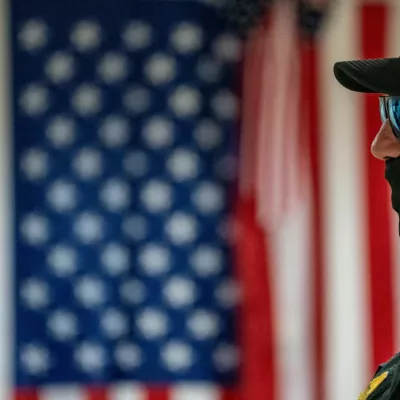 FILE PHOTO: A U.S. Customs and Border Protection officer stands guard as he waits to make detainments at U.S. immigration court in Manhattan, in New York City, U.S., July 22, 2025. REUTERS/David 'Dee' Delgado/File Photo