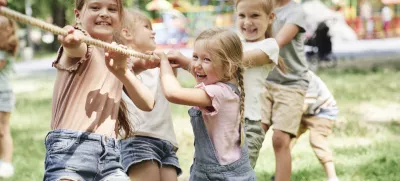 Group of kids playing tug of war