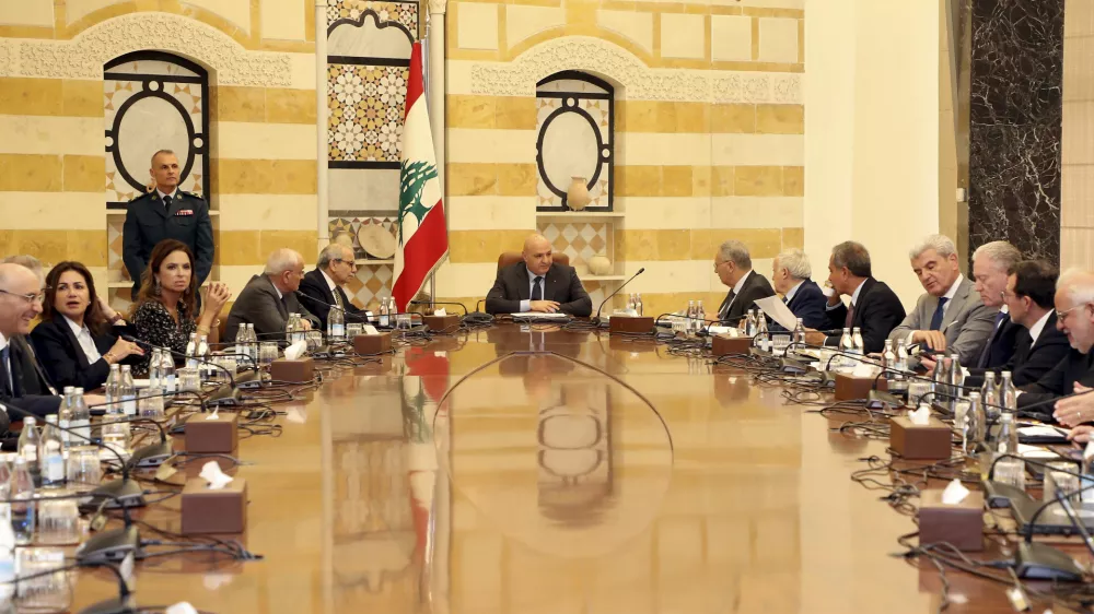 In this photo, released by the Lebanese Presidency press office, Lebanese president Joseph Aoun, centre, leads a Cabinet meeting which supposed to discuss the disarmament of Hezbollah, at the presidential palace in Baabda, east of Beirut, Lebanon, Thursday, Aug. 7, 2025. (Lebanese Presidency press office via AP)