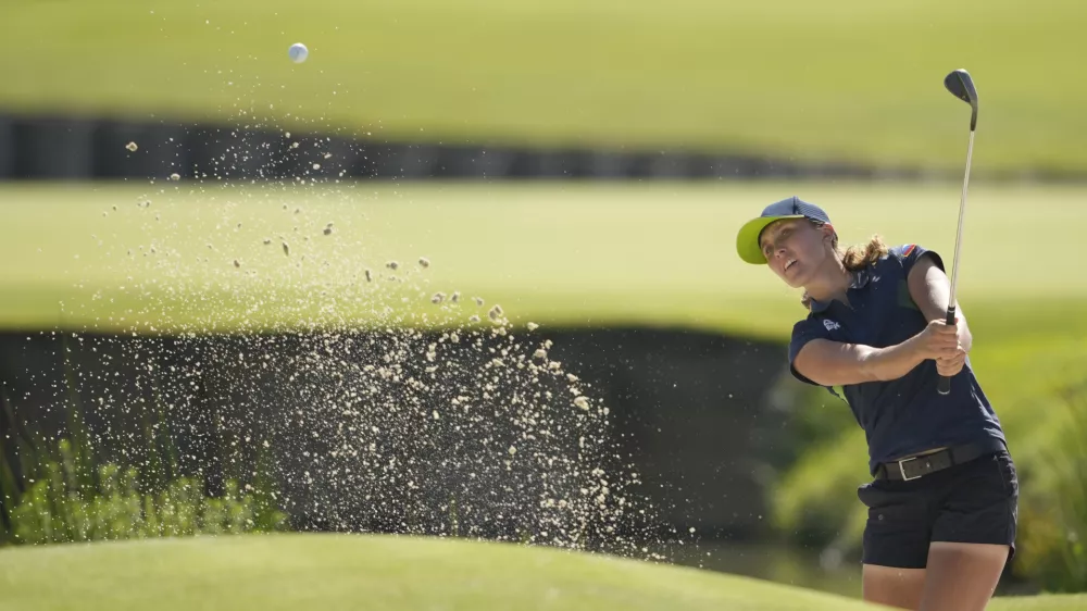 Pia Babnik, of Slovenia, plays out of a bunker on the 18th green during the final round of the women's golf event at the 2024 Summer Olympics, Saturday, Aug. 10, 2024, at Le Golf National, in Saint-Quentin-en-Yvelines, France. (AP Photo/Matt York)