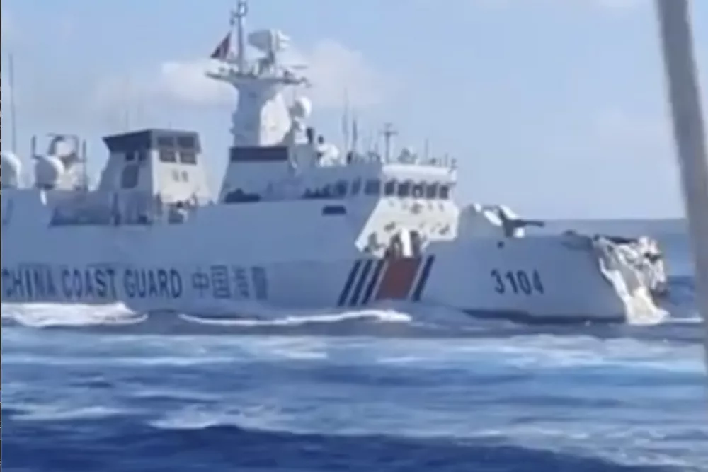 In this photo, taken from video and provided by the Philippine Coast Guard, a damaged Chinese Coast Guard ship is seen after accidentally colliding with a Chinese Navy vessel while chasing a Philippine fisheries boat near Scarborough Shoal in the disputed South China Sea on Monday Aug. 11, 2025. (Philippine Coast Guard via AP)