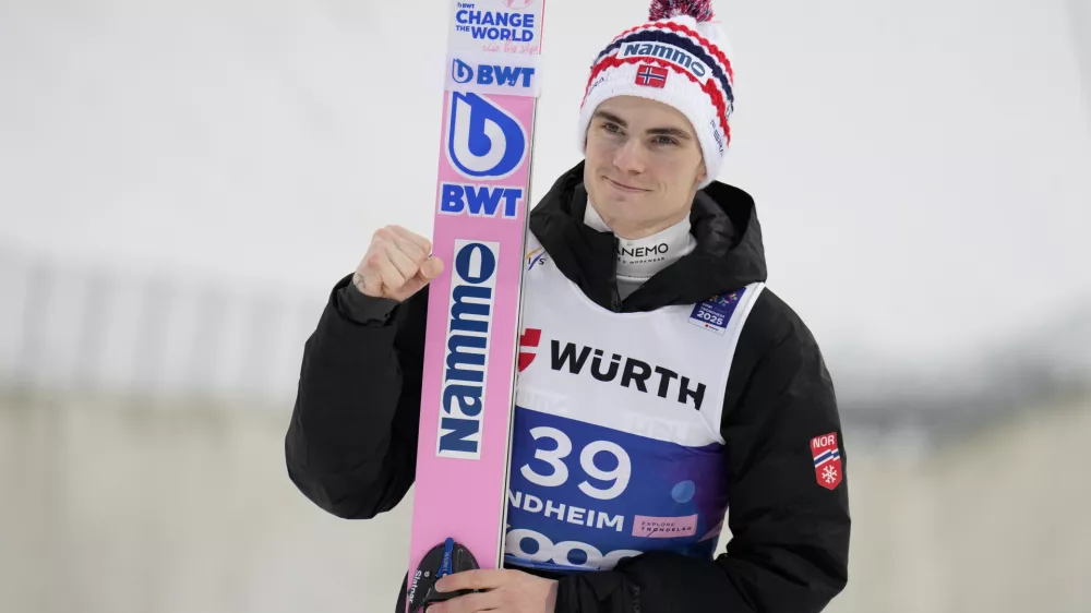 FILE - Marius Lindvik, of Norway, poses after winning the silver medal in the ski jumping men's large hill individual competition at the Nordic World Ski Championships in Trondheim, Norway, March 8, 2025. (AP Photo/Matthias Schrader, file)