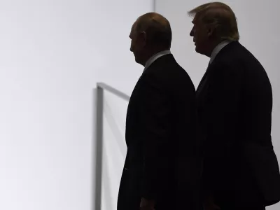FILE - President Donald Trump and Russian President Vladimir Putin walk together at the G20 summit in Osaka, Japan, June 28, 2019. (AP Photo/Susan Walsh, File)