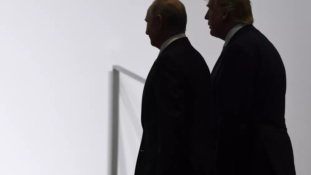 FILE - President Donald Trump and Russian President Vladimir Putin walk together at the G20 summit in Osaka, Japan, June 28, 2019. (AP Photo/Susan Walsh, File)