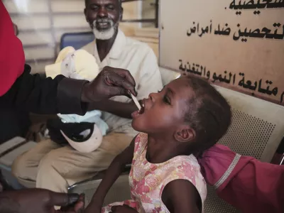 A Sudanese girl receives an oral cholera vaccine during a 10-day vaccination campaign conducted by health ministry workers in Khartoum, Sudan, Wednesday, Aug. 13, 2025. (AP Photo/Marwan Ali)
