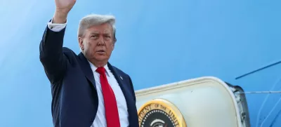 U.S. President Donald Trump waves while boarding Air Force One, as he departs for Alaska to meet with Russian President Vladimir Putin to negotiate for an end to the war in Ukraine, from Joint Base Andrews in Maryland, U.S., August 15, 2025. REUTERS/Kevin Lamarque
