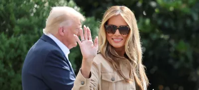 FILE PHOTO: First lady Melania Trump waves as she walks with U.S. President Donald Trump before they depart for travel to Texas to tour areas affected by deadly flash flooding, from the South Lawn of the White House in Washington, D.C., U.S., July 11, 2025. REUTERS/Jonathan Ernst/File Photo