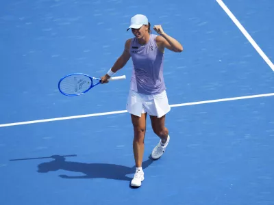 Aug 17, 2025; Cincinnati, OH, USA; Iga Swiatek (POL) reacts to defeating Elena Rybakina (KAZ) during the Cincinnati Open at the Lindner Family Tennis Center. Mandatory Credit: Aaron Doster-Imagn Images