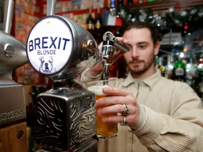 ﻿FILE PHOTO: Thibault, barman at the Cricketer English Pub, serves a Brexit draft beer in Paris, France, December 17, 2018. REUTERS/Charles Platiau/File Photo