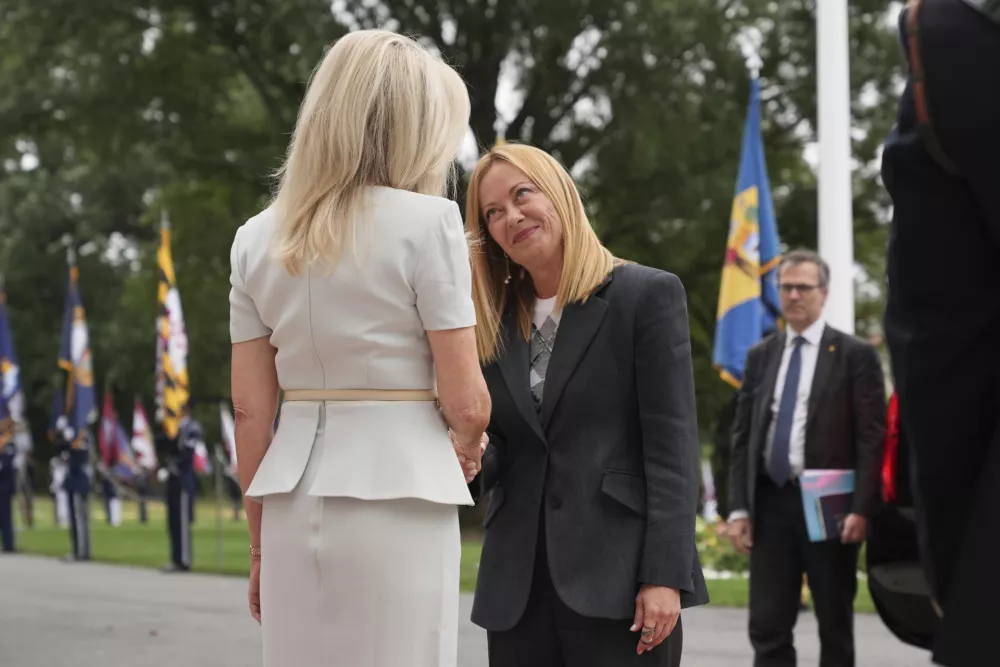 Monica Crowley, White House chief of protocol, left, greets Italy's Prime Minister Giorgia Meloni upon arriving to meet with President Donald Trump and Ukraine's President Volodymyr Zelenskyy, Monday, Aug. 18, 2025, at the South Portico of the White House in Washington. (AP Photo/Jacquelyn Martin)