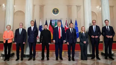 U.S. President Donald Trump, Ukrainian President Volodymyr Zelenskiy, German Chancellor Friedrich Merz, French President Emmanuel Macron, British Prime Minister Keir Starmer, Italian Prime Minister Giorgia Meloni, and Finland's President Alexander Stubb, NATO Secretary General Mark Rutte and European Commission President Ursula von der Leyen pose for a family photo amid negotiations to end the Russian war in Ukraine, at the White House in Washington, D.C., U.S., August 18, 2025. REUTERS/Alexander Drago   TPX IMAGES OF THE DAY