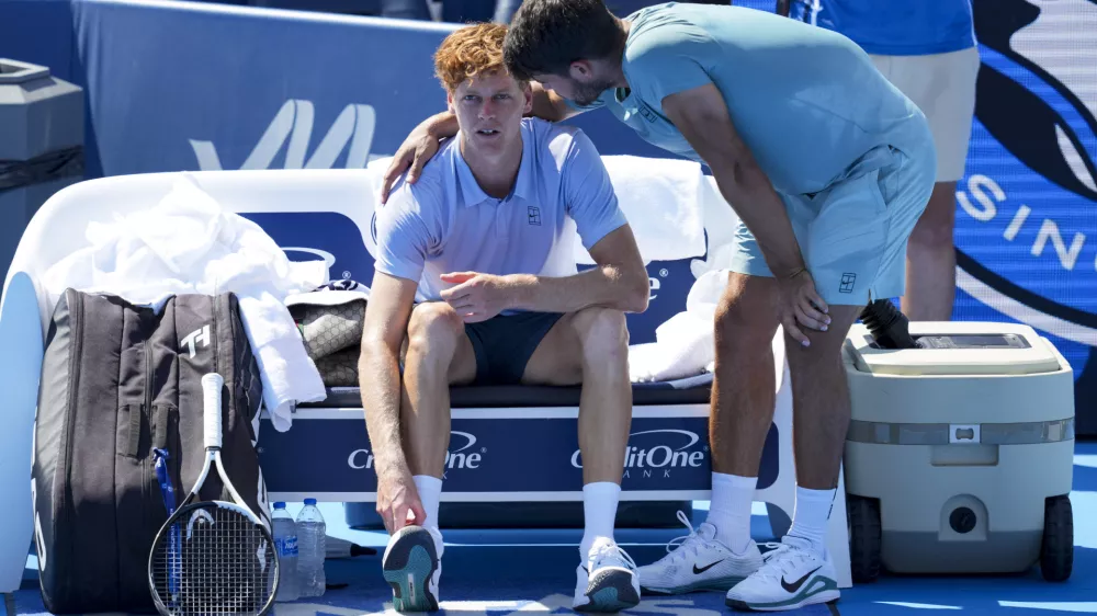 Aug 18, 2025; Cincinnati, OH, USA; Jannik Sinner (ITA), left, talks with Carlos Alcaraz (ESP) after retiring from their match during the Cincinnati Open at the Lindner Family Tennis Center. Mandatory Credit: Aaron Doster-Imagn Images