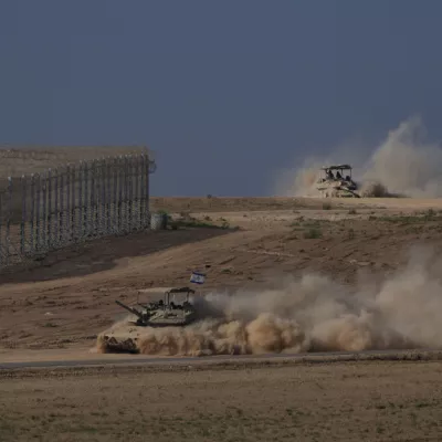 Israeli tanks moves through an area near the Israeli-Gaza border, as seen from southern Israel, Monday, Aug. 18, 2025. (AP Photo/Maya Levin)