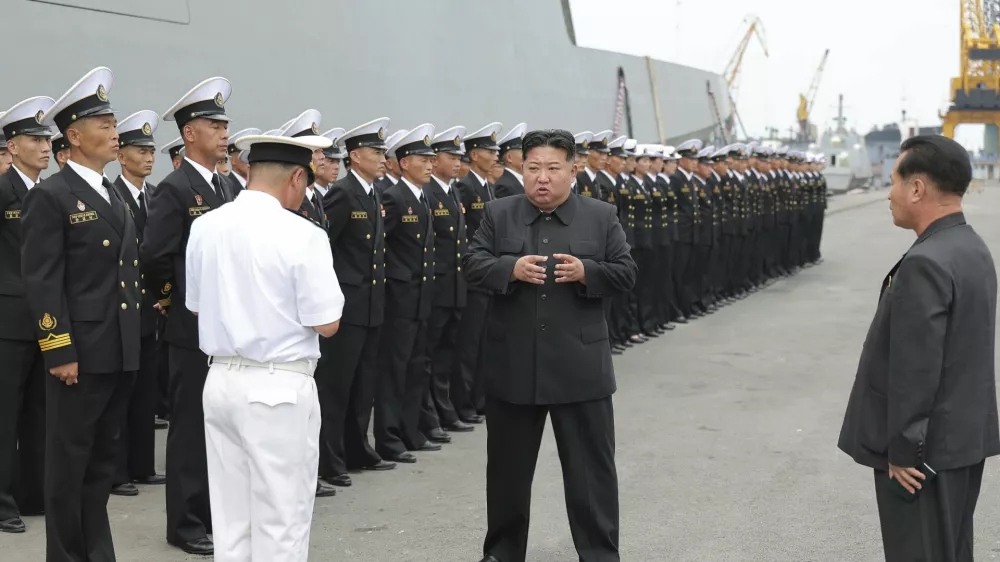 In this photo provided by the North Korean government, North Korean leader Kim Jong Un, center, inspects the warship Choe Hyon in Nampo, North Korea, on Aug. 18, 2025. Independent journalists were not given access to cover the event depicted in this image distributed by the North Korean government. The content of this image is as provided and cannot be independently verified. Korean language watermark on image as provided by source reads: "KCNA" which is the abbreviation for Korean Central News Agency. (Korean Central News Agency/Korea News Service via AP)