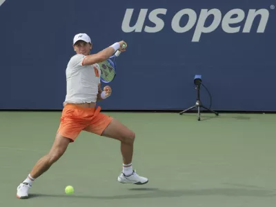 Casper Ruud, of Norway, returns a shot to Raphael Collignon, of Belgium, during the second round of the U.S. Open tennis championships, Wednesday, Aug. 27, 2025, in New York. (AP Photo/Andres Kudacki)