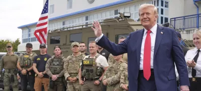 President Donald Trump speaks with members of law enforcement and National Guard soldiers, Thursday, Aug. 21, 2025, in Washington. (AP Photo/Jacquelyn Martin)