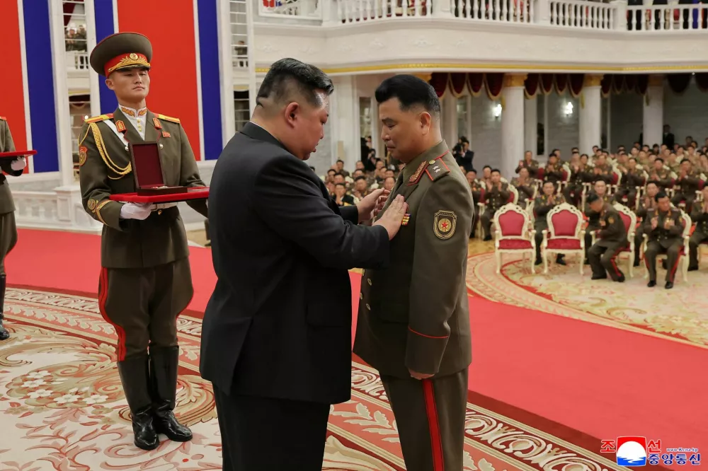 North Korean leader Kim Jong attends a national commendation ceremony for the commanders and fighters of the Korean People's Army's overseas operations unit, at the headquarters of the Central Committee of the Korean Workers' Party, in Pyongyang, North Korea, in this photo released on August 22, 2025 by North Korea's Korean Central News Agency (KCNA). KCNA via REUTERS ATTENTION EDITORS - THIS IMAGE WAS PROVIDED BY A THIRD PARTY. REUTERS IS UNABLE TO INDEPENDENTLY VERIFY THIS IMAGE. NO THIRD PARTY SALES. SOUTH KOREA OUT. NO COMMERCIAL OR EDITORIAL SALES IN SOUTH KOREA.