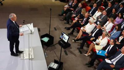 French Prime Minister Francois Bayrou delivers a speech as members of the French government listen to during a press conference about his 2026 budget in Paris, France, August 25, 2025. REUTERS/Abdul Saboor