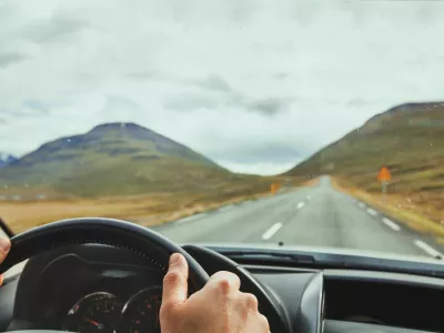 PYTTDD travel, driving car on a beautiful scenic road in Iceland