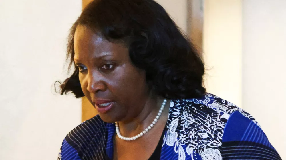 FILE PHOTO: Federal Reserve Governor Lisa Cook attends the Federal Reserve Bank of Kansas City's 2025 Jackson Hole economic symposium, "Labor Markets in Transition: Demographics, Productivity, and Macroeconomic Policy" in Jackson Hole, Wyoming, U.S., August 23, 2025. REUTERS/Jim Urquhart/File Photo