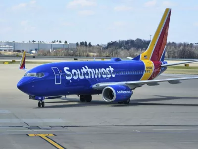 FILE - A Southwest Airlines plane pull into a gate at Pittsburgh International Airport in Imperial, Pa., Thursday, March 27, 2025. (AP Photo/Gene J. Puskar, File)