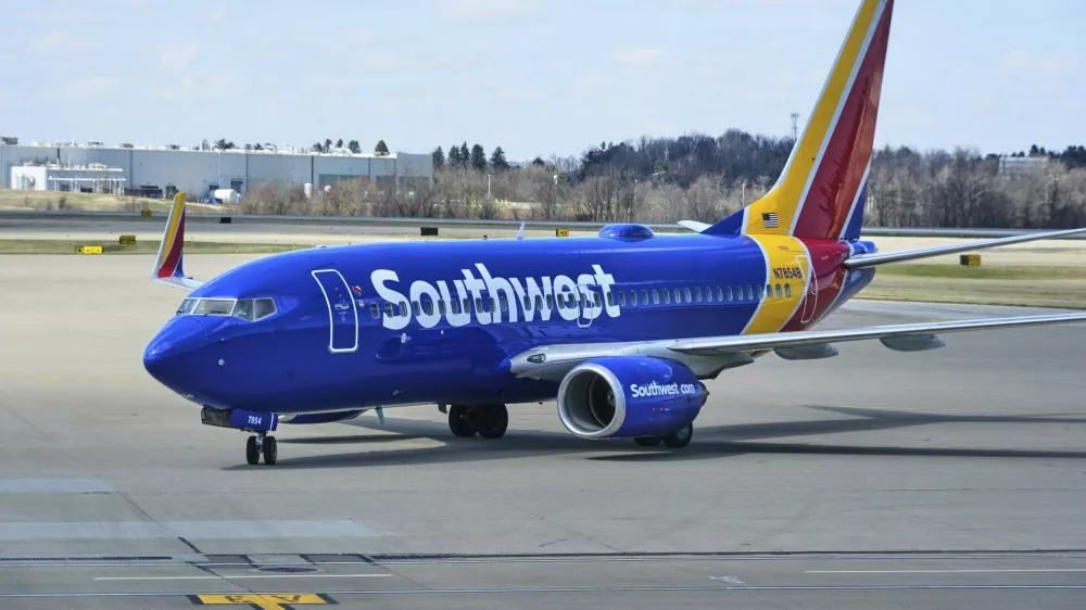 FILE - A Southwest Airlines plane pull into a gate at Pittsburgh International Airport in Imperial, Pa., Thursday, March 27, 2025. (AP Photo/Gene J. Puskar, File)
