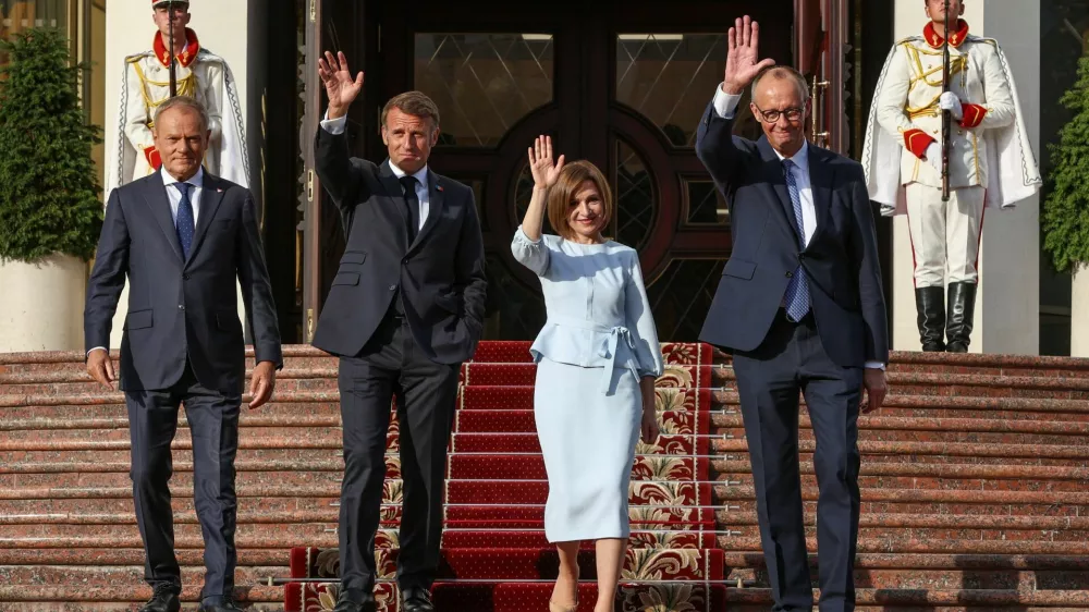 Poland's Prime Minister Donald Tusk, France's President Emmanuel Macron, Moldovan President Maia Sandu, and Germany's Chancellor Friedrich Merz walk after a meeting at the Presidential Palace in Chisinau, Moldova, August 27, 2025. REUTERS/Vladislav Culiomza   TPX IMAGES OF THE DAY