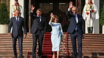 Poland's Prime Minister Donald Tusk, France's President Emmanuel Macron, Moldovan President Maia Sandu, and Germany's Chancellor Friedrich Merz walk after a meeting at the Presidential Palace in Chisinau, Moldova, August 27, 2025. REUTERS/Vladislav Culiomza   TPX IMAGES OF THE DAY