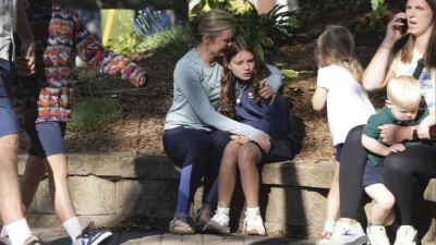 Parents await news of their children's status after a shooting at Annunciation Church on Wednesday, Aug. 27, 2025 in Minneapolis. (Alex Kormann/Star Tribune via AP)/