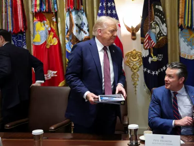 U.S. President Donald Trump leaves, following a cabinet meeting, next to Secretary of State Marco Rubio and Defense Secretary Pete Hegseth, at the White House in Washington, D.C., U.S., August 26, 2025. REUTERS/Jonathan Ernst