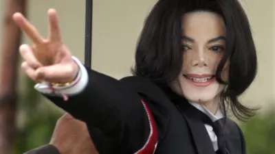 File-In this Feb.,2005 file photo showing Michael Jackson arriving for the first day of his child molestation trial at the Santa Barbara County Superior Court in Santa Maria, Calif. (AP Photo/Michael A. Mariant,File)