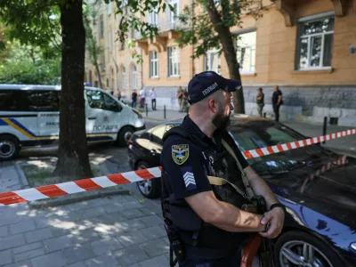 A police officer guards at the site of a murder of former Ukrainian parliamentary speaker Andriy Parubiy, who was killed this morning, amid Russia's attack on Ukraine, in Lviv, Ukraine August 30, 2025. REUTERS/Roman Baluk