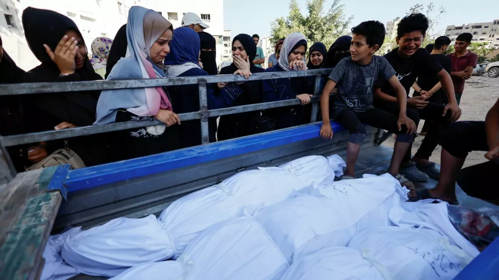 Mourners react during the funeral of Palestinians killed in overnight Israeli strikes, according to medics, at Al-Shifa Hospital in Gaza City, September 1, 2025. REUTERS/Mahmoud Issa