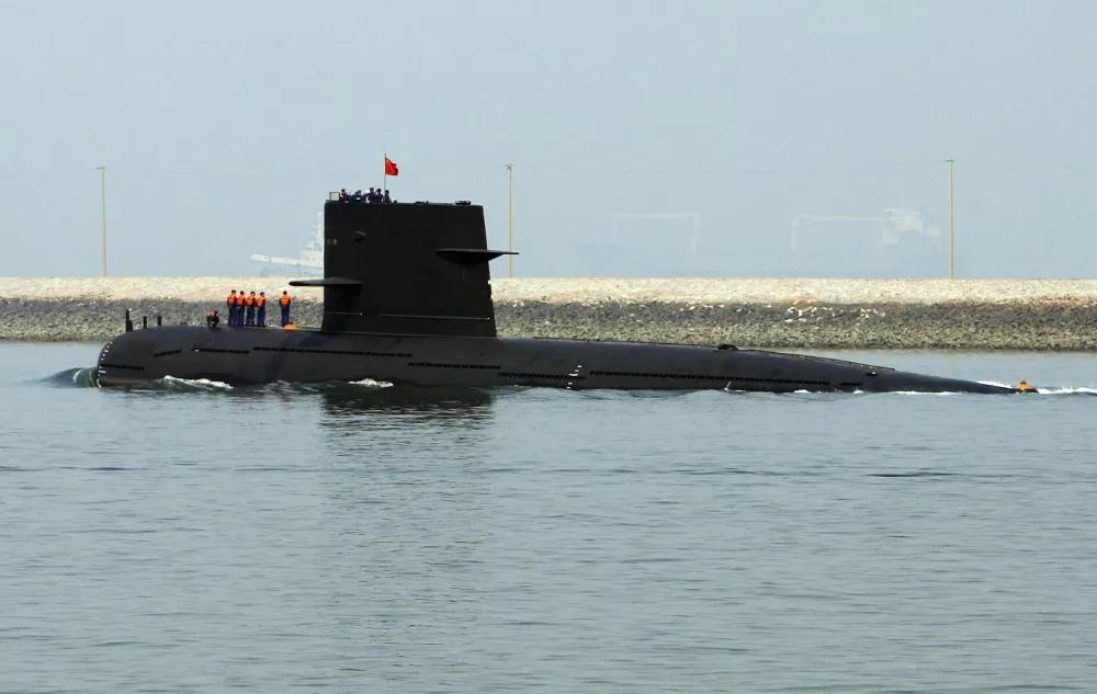 A Chinese navy submarine leaves Qingdao Port, Shandong province April 22, 2009. China will show off its resurgent naval strength this week at a parade marking 60 years since the founding of its navy, presenting its fleet of warships and nuclear submarines as a force for peace, not aggression. REUTERS/Guang Niu/Pool (CHINA POLITICS MILITARY)