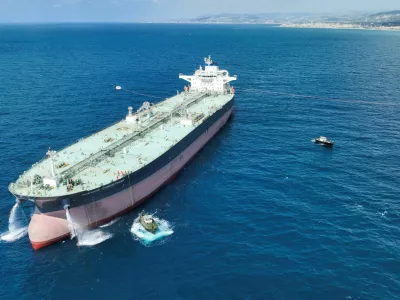 A drone view shows crude oil tanker Nissos Christiana, first ship to transport oil from Syria since the fall of Bashar al-Assad's regime, anchored in the port of Tartus, Syria, September 1, 2025. REUTERS/Mahmoud Hassano