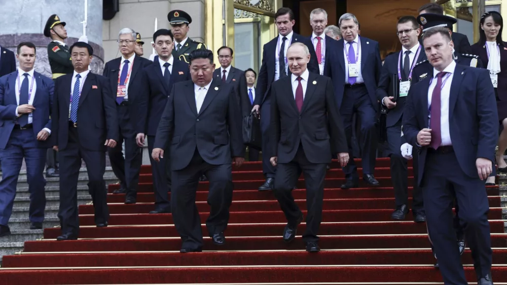 Russian President Vladimir Putin, center right, and North Korean leader Kim Jong Un, center left, leave a reception following a military parade to commemorate the 80th anniversary of the end of World War II in Beijing, China, Wednesday, Sept. 3, 2025. (Alexander Kazakov, Sputnik, Kremlin Pool Photo via AP)