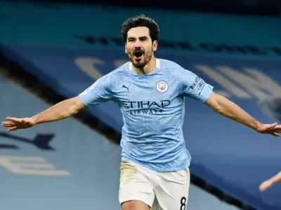 FILE - Manchester City's Ilkay Gundogan celebrates after scoring his side's third goal during the English Premier League soccer match between Manchester City and Tottenham Hotspur at Etihad Stadium in Manchester, England, on Feb. 13, 2021. (AP Photo/Rui Vieira, Pool File)