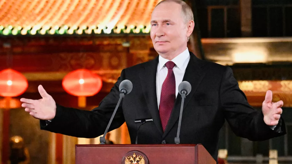 Russian President Vladimir Putin gestures during a press conference, at the end of his visit to China for the Tianjin SCO Summit and the military parade to mark the 80th anniversary of the end of World War Two, in Beijing, China, Wednesday, Sept. 3, 2025. (Sergei Bobylev, Sputnik, Kremlin Pool Photo via AP)