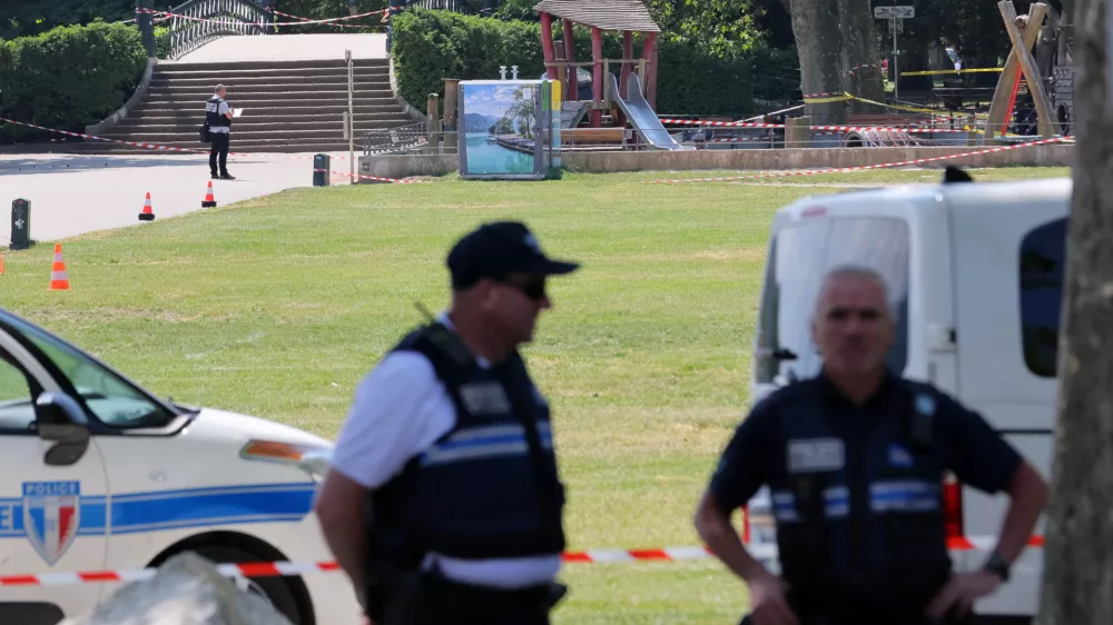 French police secure the area after several children and an adult have been injured in a knife attack in Annecy, in the French Alps, France, June 8, 2023. REUTERS/Denis Balibouse