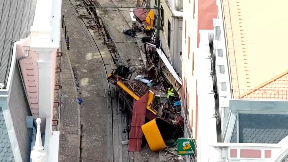 A drone view shows the site of the accident after Gloria Funicular railway car, a popular tourist attraction, derailed and crashed, resulting in multiple casualties, according to authorities, in Lisbon, Portugal, September 4, 2025. REUTERS TV/via REUTERS. PORTUGAL OUT. NO COMMERCIAL OR EDITORIAL SALES IN PORTUGAL
