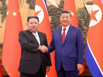 Chinese President Xi Jinping and Democratic People's Republic of Korea (DPRK) leader Kim Jong Un shake hands at the Great Hall of the People in Beijing, China September 4, 2025. China Daily via REUTERS ATTENTION EDITORS - THIS IMAGE WAS PROVIDED BY A THIRD PARTY. CHINA OUT.
