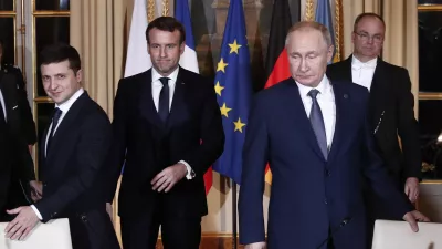 ﻿Russian President Vladimir Putin, right, Ukrainian President Volodymyr Zelenskiy, left, and French President Emmanuel Macron, center, arrive at a working session at the Elysee Palace Monday, Dec. 9, 2019 in Paris. Russian President Vladimir Putin and Ukraine's president are meeting for the first time at a summit in Paris to find a way to end the five years of fighting in eastern Ukraine. (Ian Langsdon/Pool via AP)