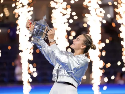 Sep 6, 2025; Flushing, NY, USA; Aryna Sabalenka celebrates with the championship trophy after defeating Amanda Anisimova (USA) (not pictured) the women's singles final of the 2025 US Open tennis championships at Billie Jean King National Tennis Center. Mandatory Credit: Robert Deutsch-Imagn Images