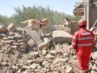 FILED - 11 October 2023, Afghanistan, Herat: The Iranian rescue team and Afghan men search for victims after an earthquake in Herat province, western Afghanistan. Thousands were killed and injured. Photo: Iranian Red Crescent Society/ZUMA Press Wire/dpa
