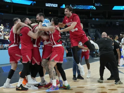 Basketball - FIBA EuroBasket 2025 - Round of 16 - France v Georgia - Xiaomi Arena, Riga, Latvia - September 7, 2025 Georgia players celebrate after the match REUTERS/Ints Kalnins