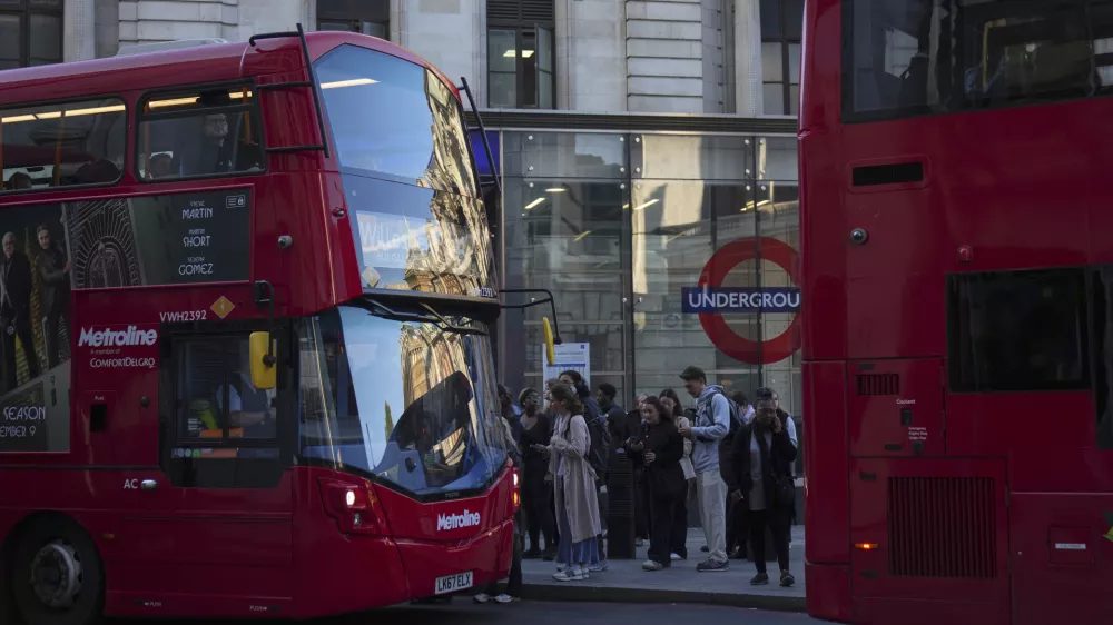 People queue for buses in London during a strike by members of the Rail, Maritime and Transport union (RMT), in central London, Monday, Sept. 8, 2025. (AP Photo/Joanna Chan)